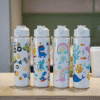 1pc, 23oz cute cartoon pattern plastic water school bottle, with lid, straw, and drawstring.